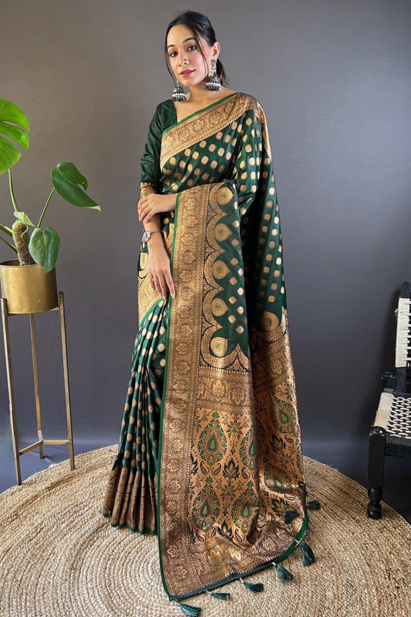 Tiny zari weaving adorn these dark green Banarasi Katan Silk Sarees.