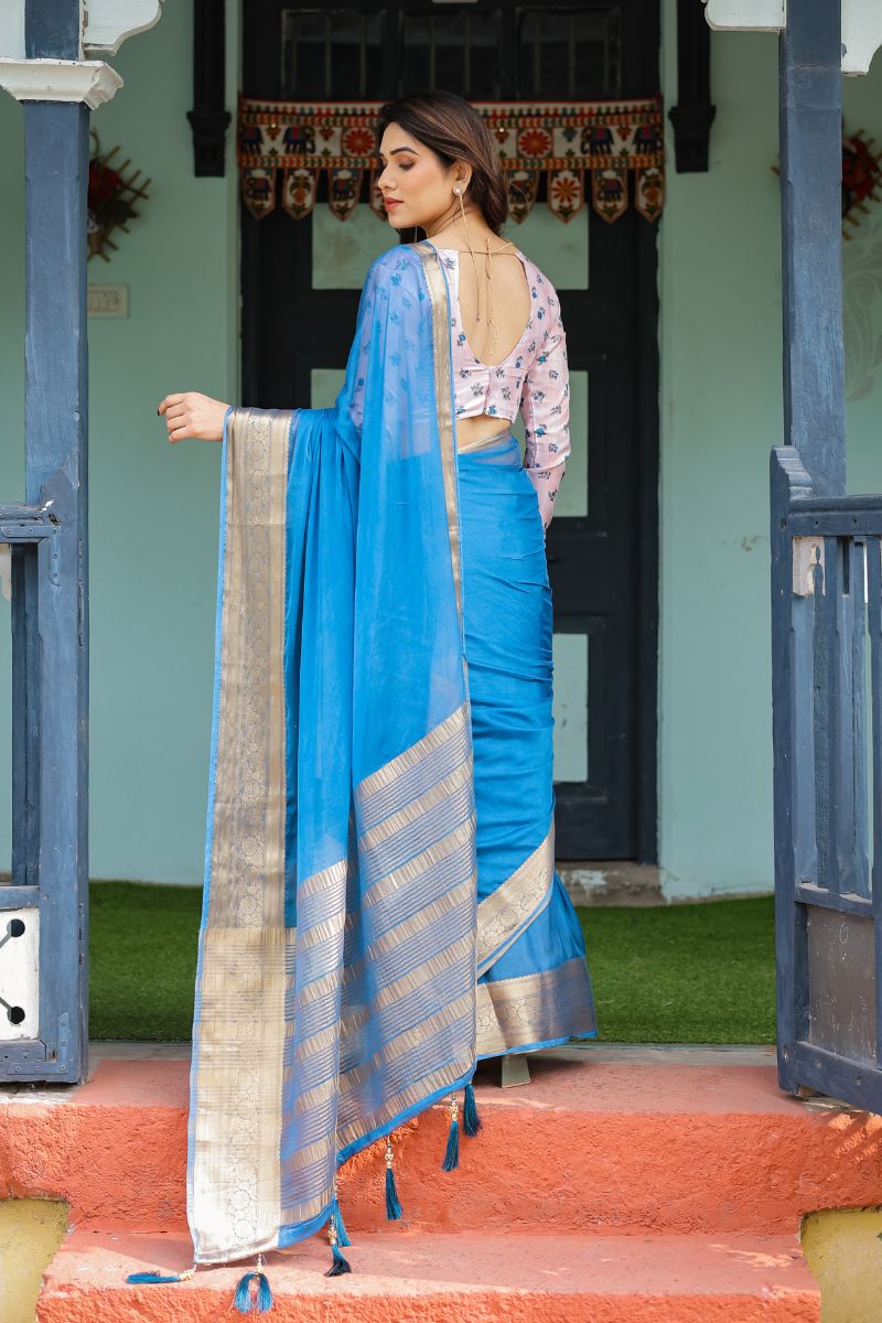 A new sky blue chiffon saree with a flowing drape
