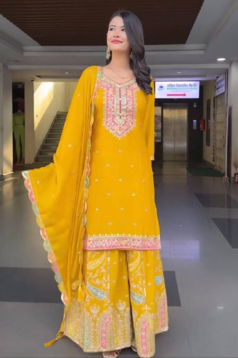 Malty-threaded yellow heavy chinon silk sharara suit.