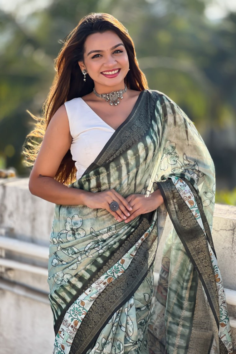A soft, green Chanderi crush saree with floral designs