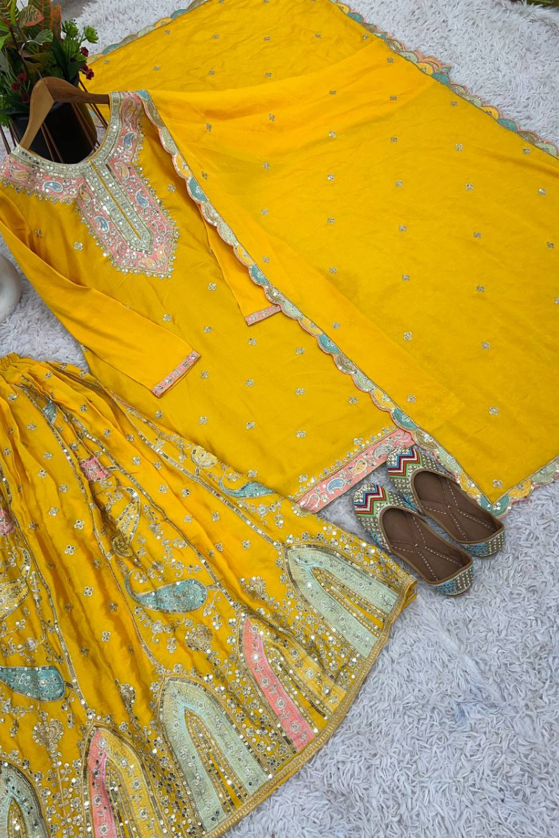 Malty-threaded yellow heavy chinon silk sharara suit.