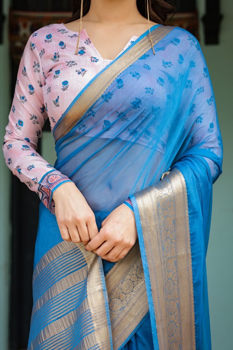 A new sky blue chiffon saree with a flowing drape