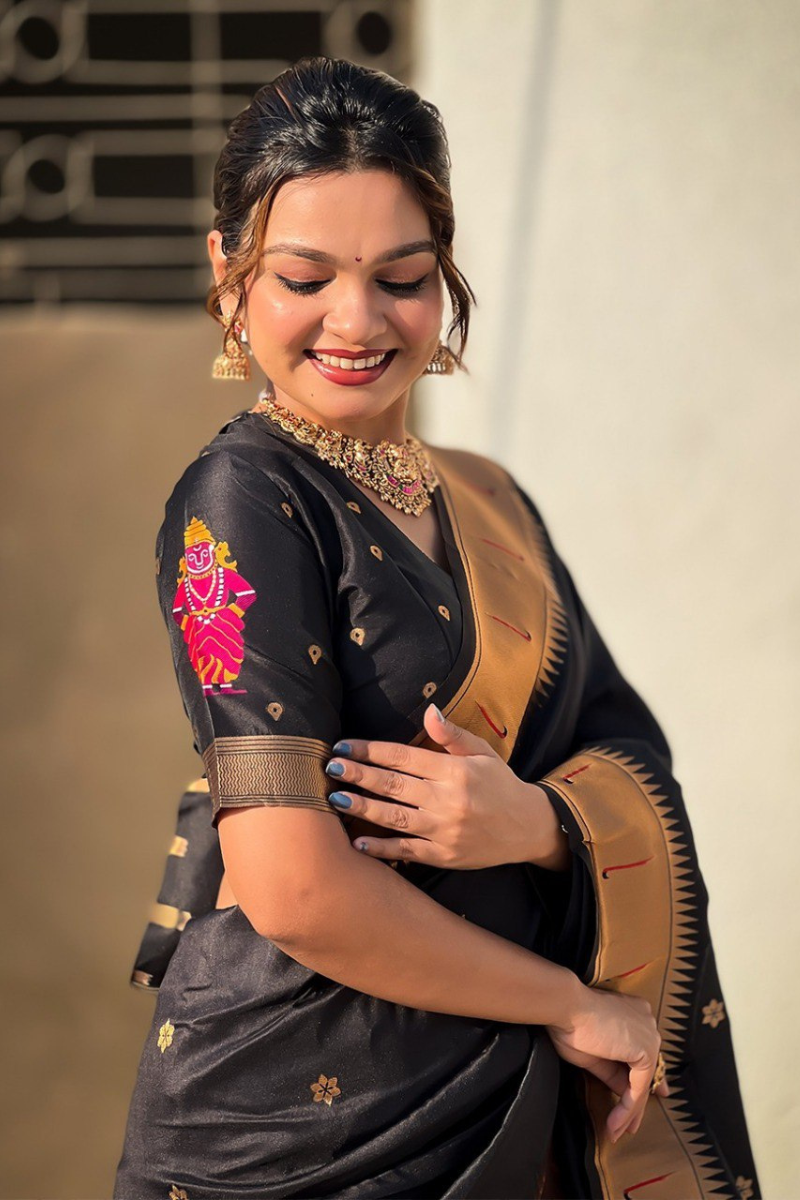 Floral designs woven into black soft silk sarees