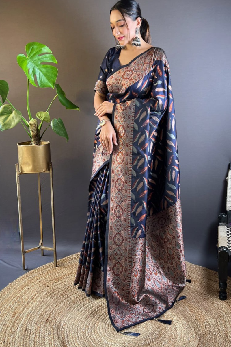 Sarees made of soft black silk with distinctive triple Zari paan weaves