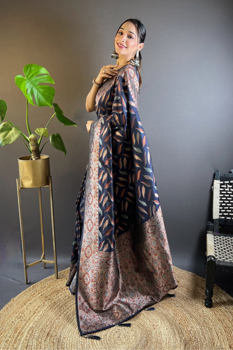 Sarees made of soft black silk with distinctive triple Zari paan weaves
