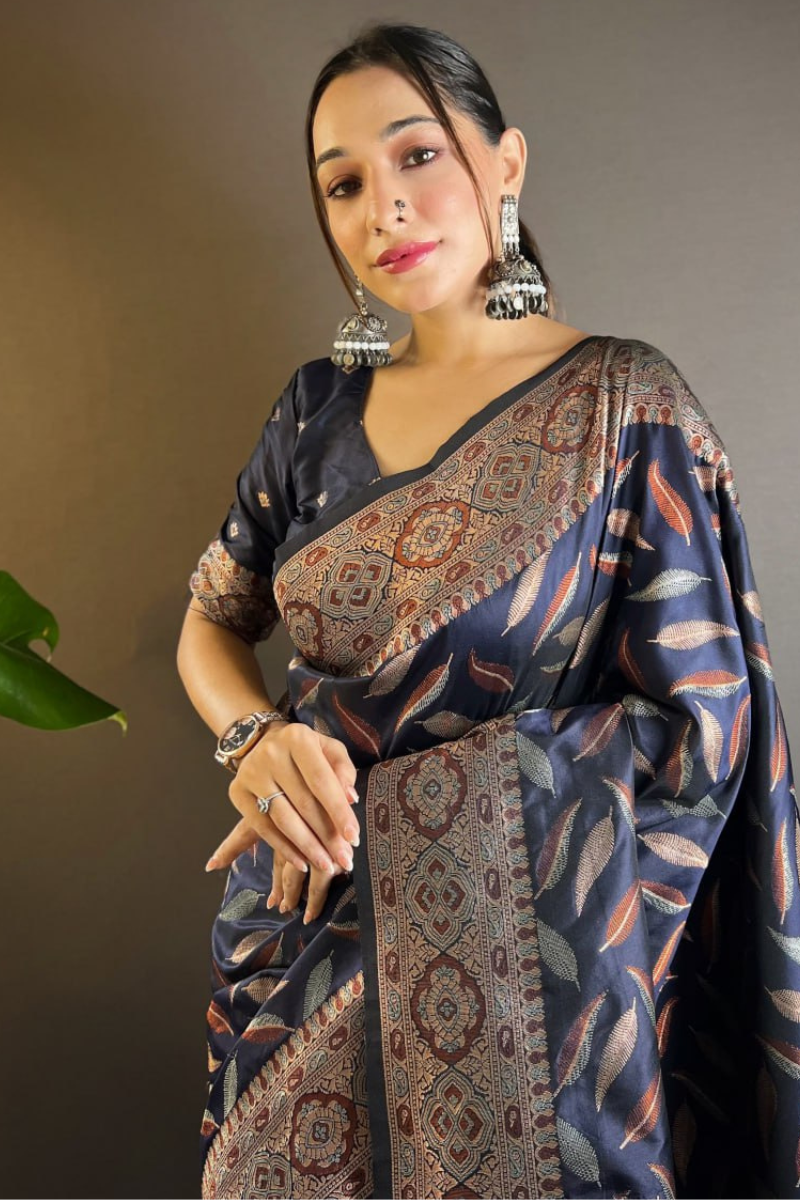 Sarees made of soft black silk with distinctive triple Zari paan weaves