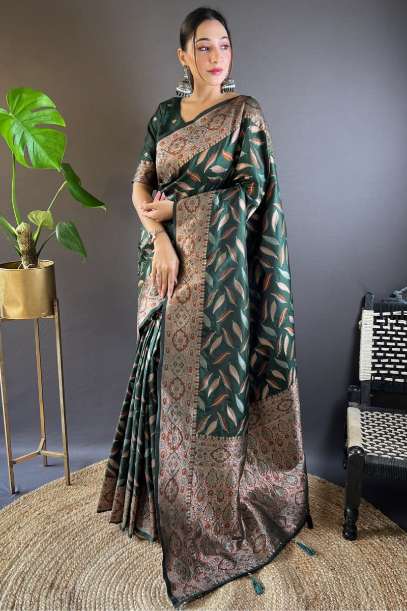 Sarees made of soft silk in a dark green color with distinctive triple Zari paan weaves