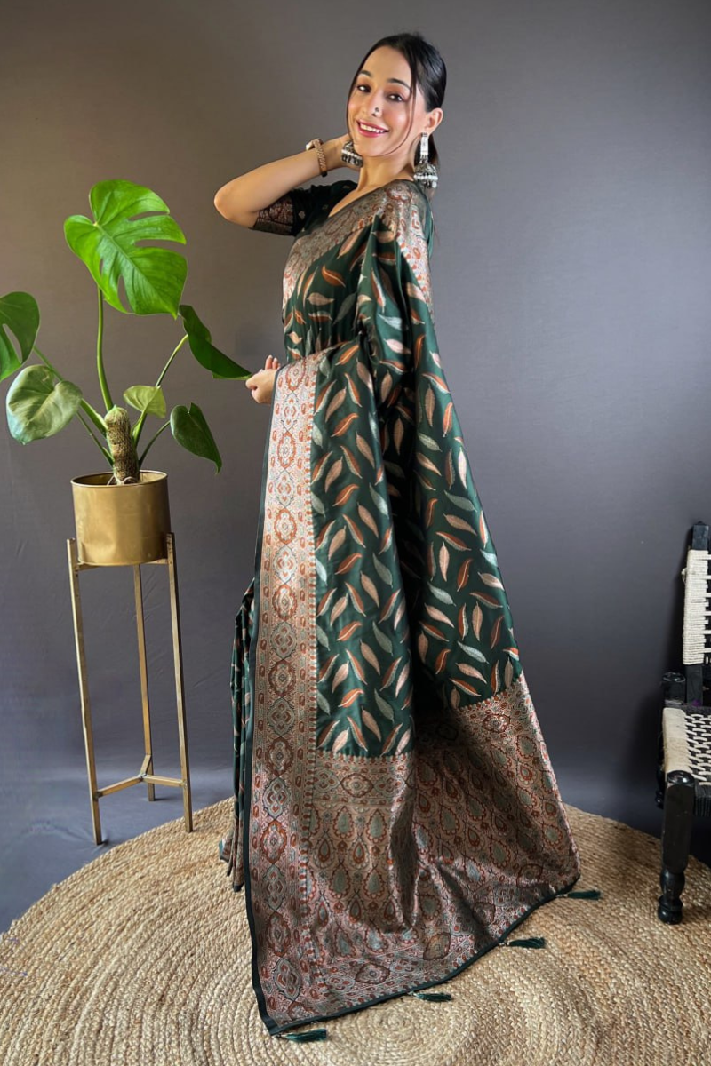 Sarees made of soft silk in a dark green color with distinctive triple Zari paan weaves