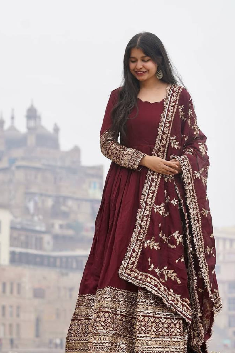 Faux Maroon Three-piece suit set with a Georgette gown, dupatta, and pants