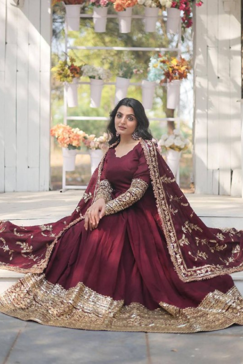 Faux Maroon Three-piece suit set with a Georgette gown, dupatta, and pants