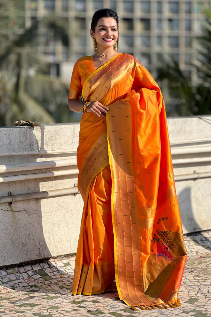 Soft silk sarees in orange Paithani with floral designs