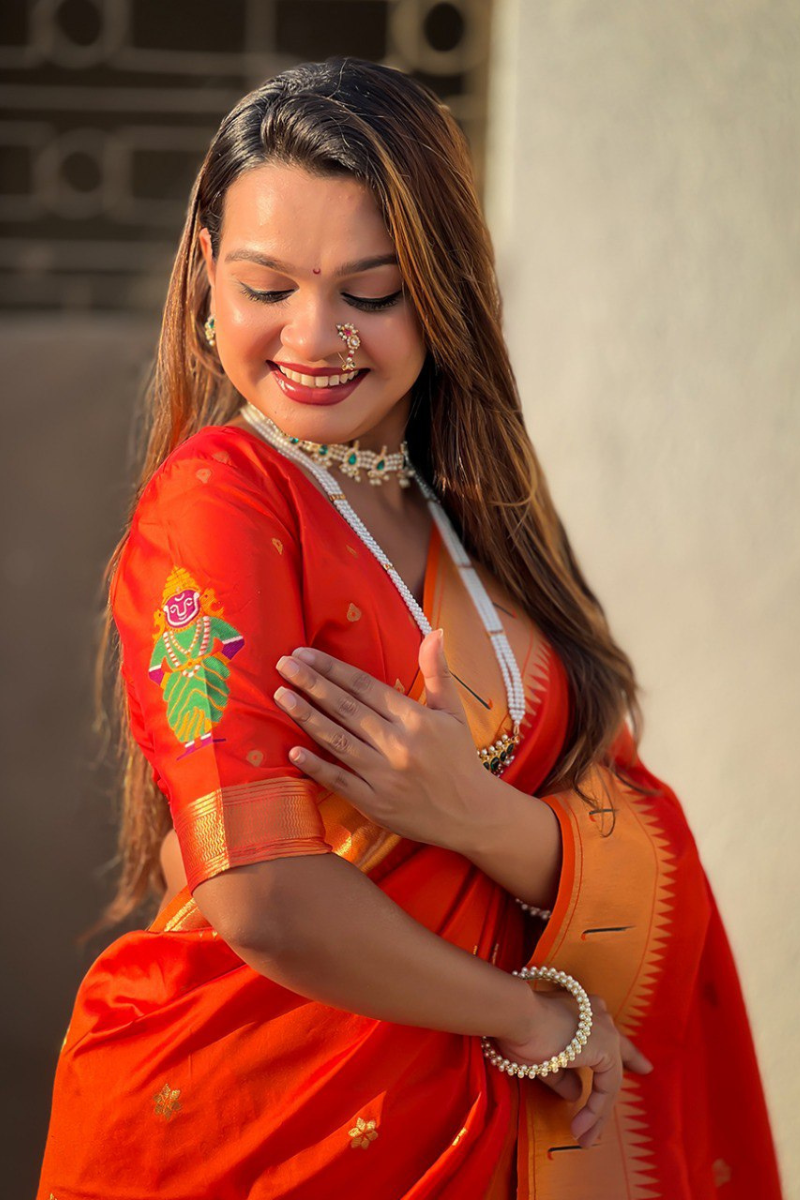 Sarees made of soft silk in orange with floral designs