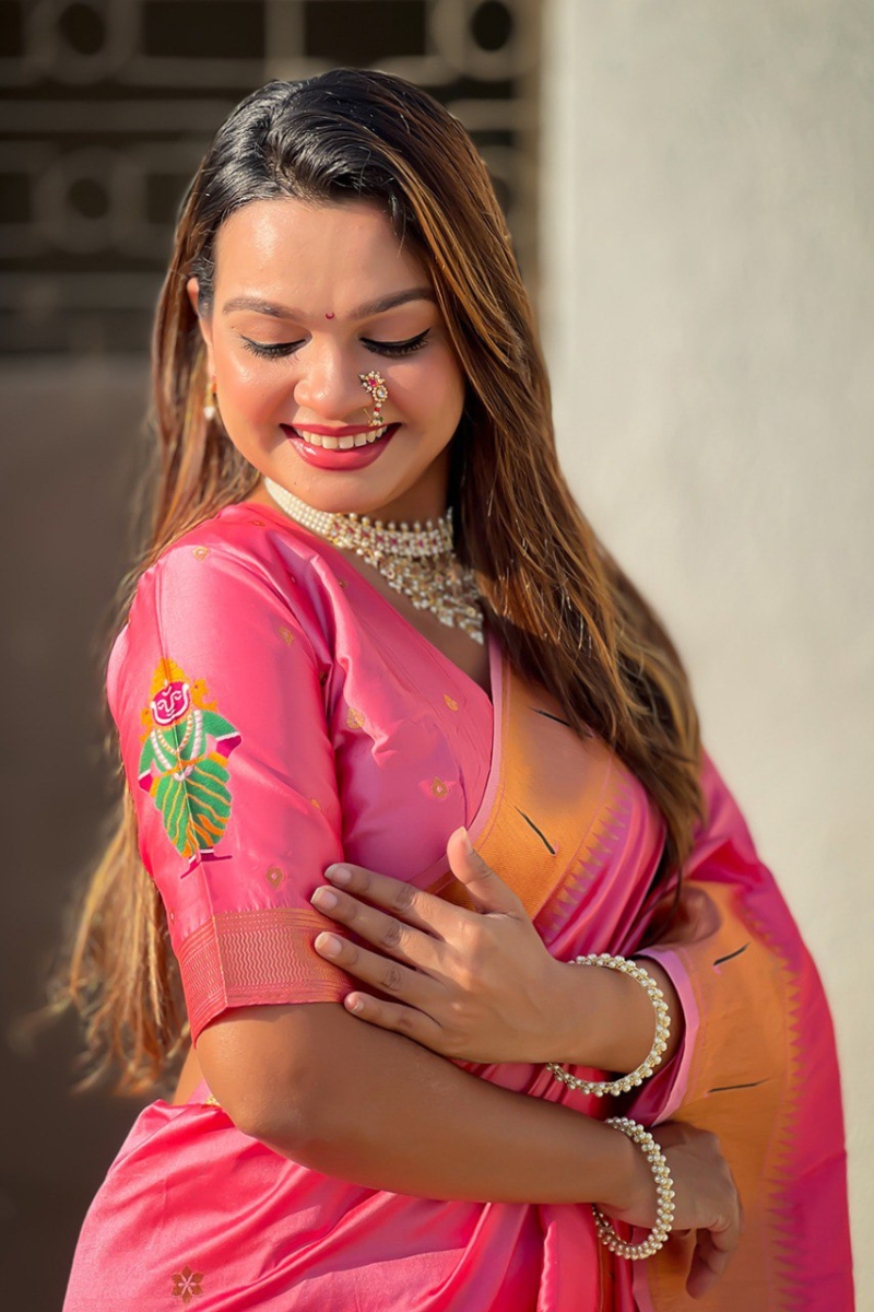 Floral designs woven into pink soft silk sarees