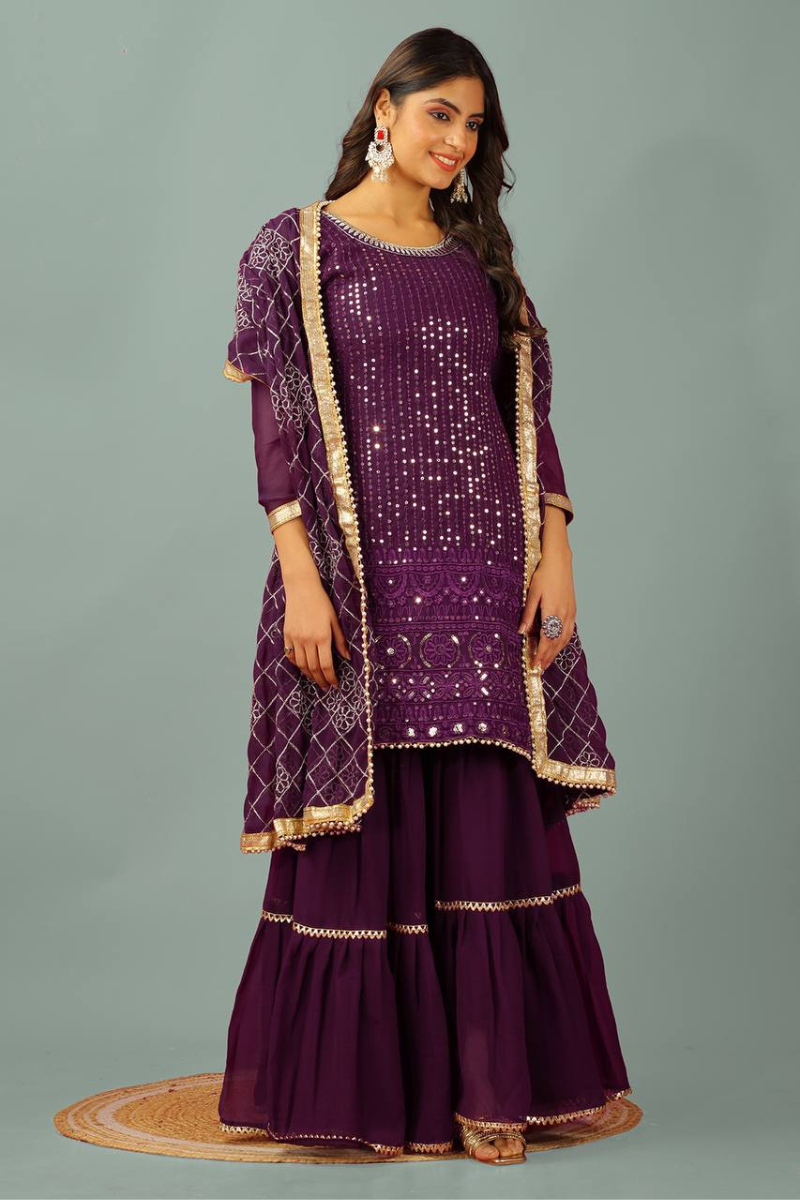 Three-piece embroidered kurta dupatta suit set in purple faux georgette