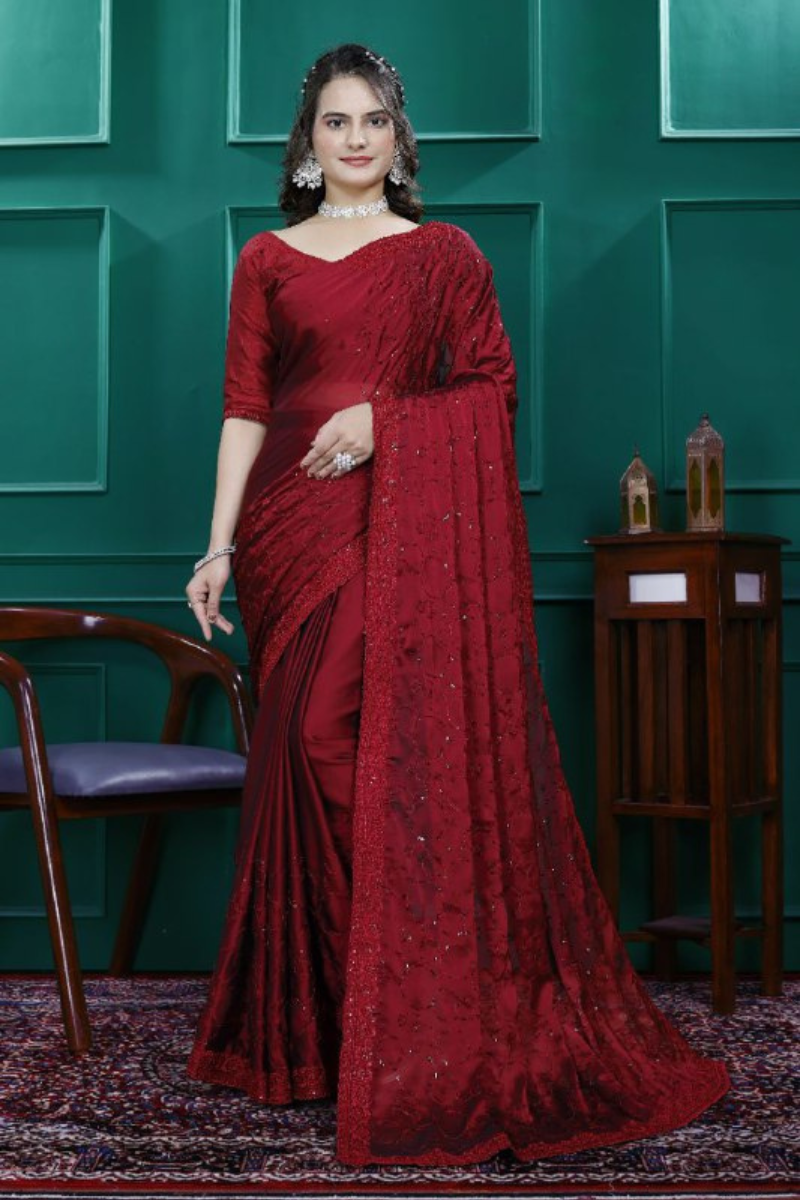 Multi-sequence and cut embroidery on a red rangoli silk saree