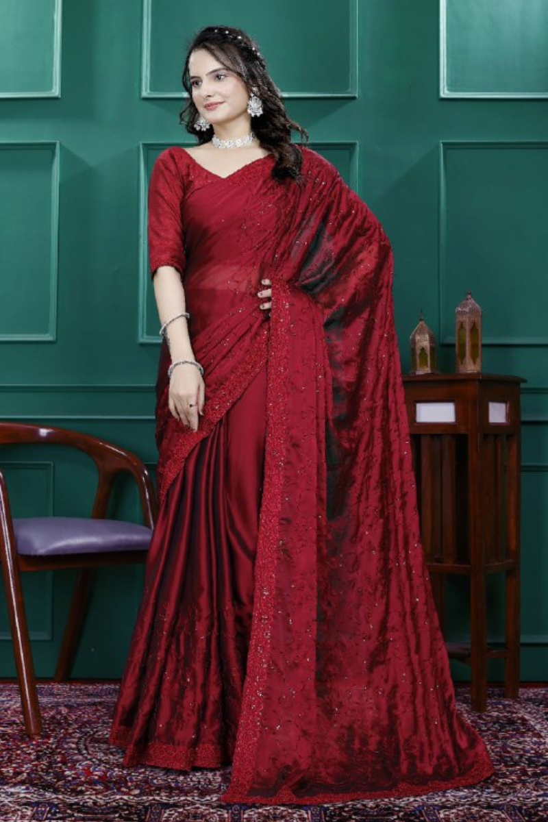 Multi-sequence and cut embroidery on a red rangoli silk saree