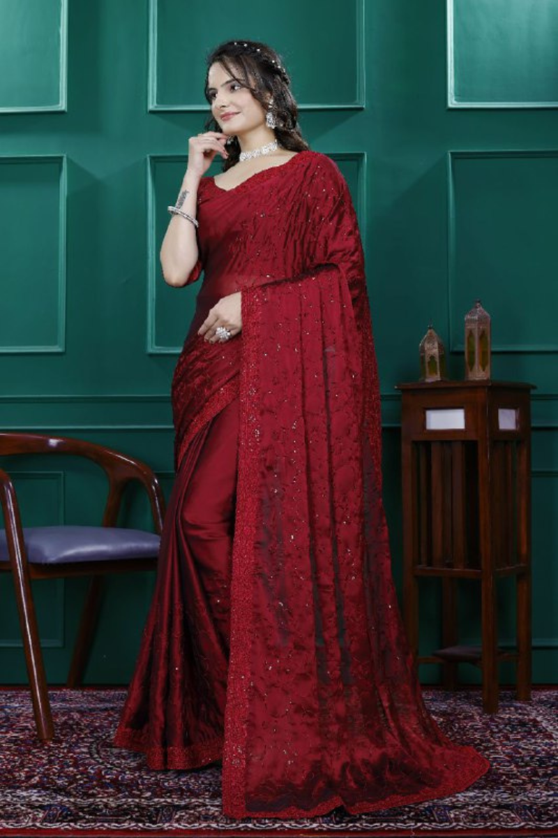 Multi-sequence and cut embroidery on a red rangoli silk saree