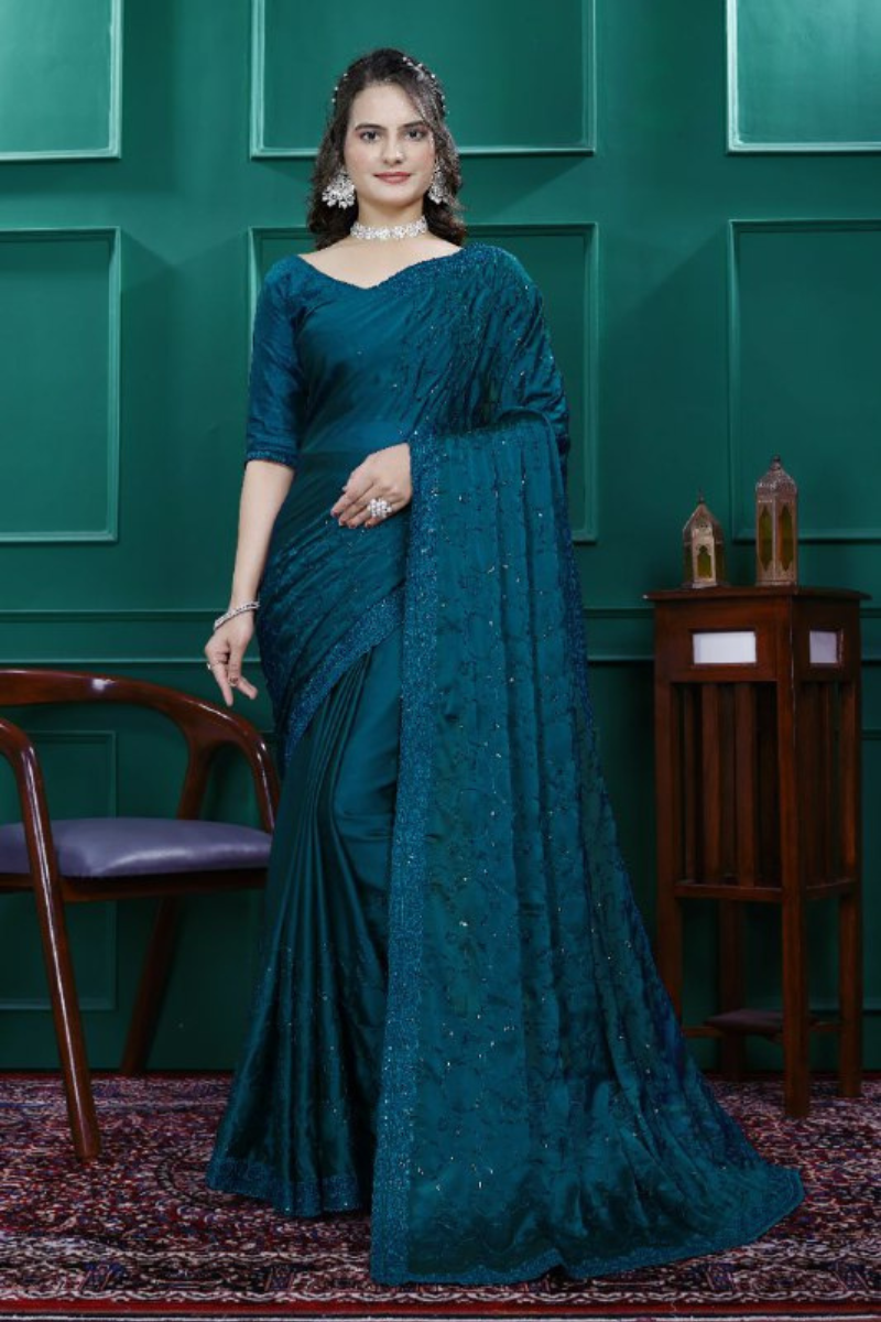 Multi-sequence and cut embroidery on a teal rangoli silk saree
