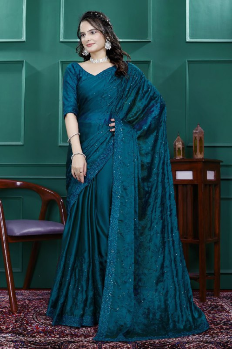 Multi-sequence and cut embroidery on a teal rangoli silk saree