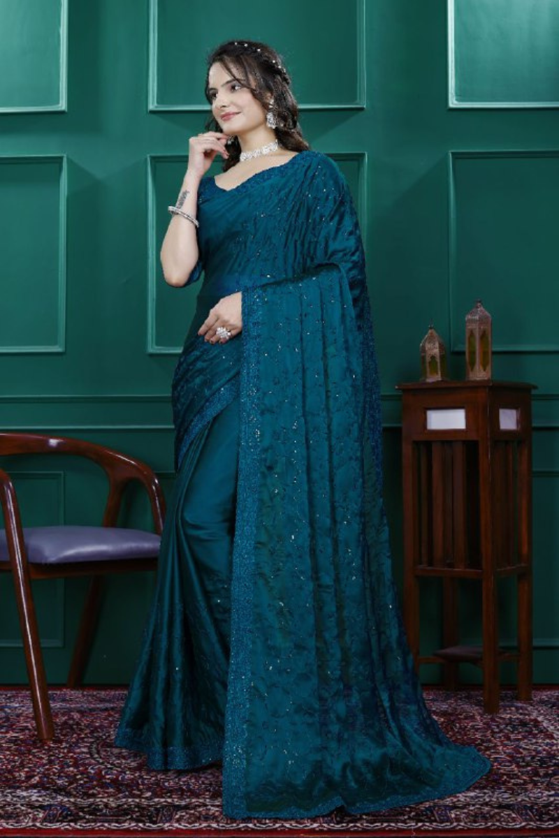 Multi-sequence and cut embroidery on a teal rangoli silk saree