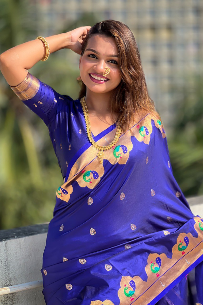 Sarees in violet Paithani with zari patterns throughout